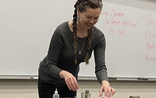 Woman leading watercolor making class